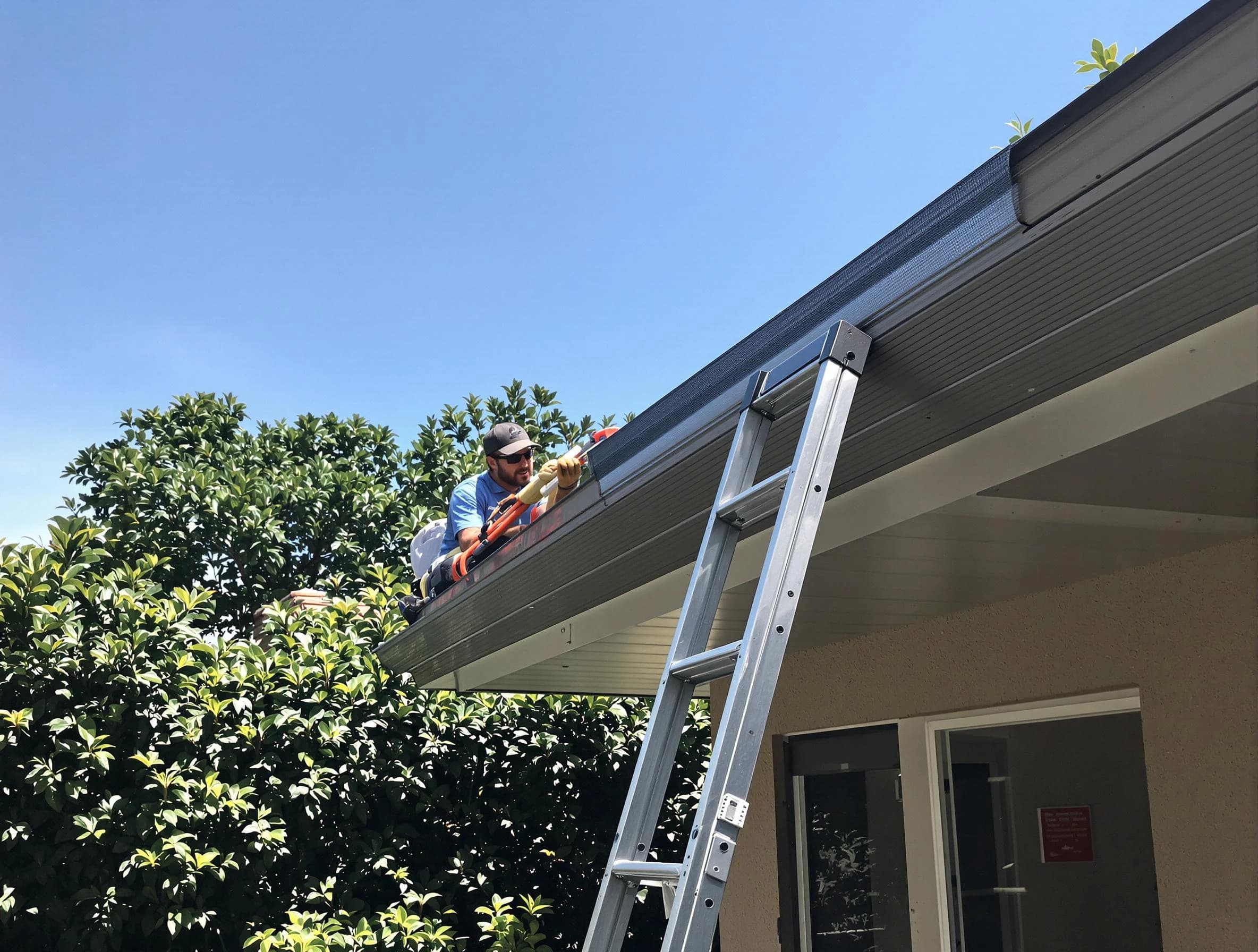 University Heights Roofing Company installing gutter guards for a homeowner in University Heights, OH