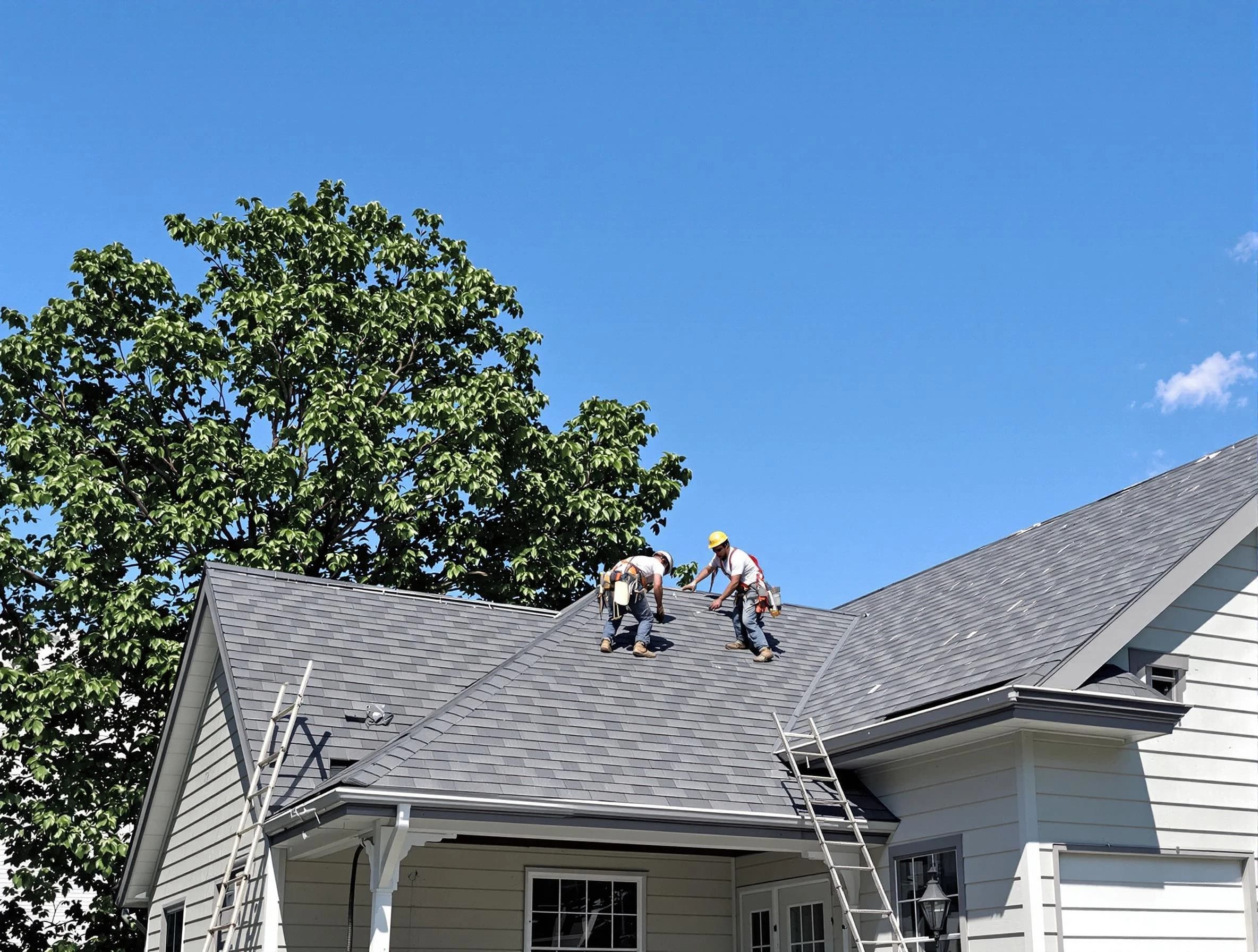 University Heights Roofing Company crew finalizing a roof installation in University Heights, OH